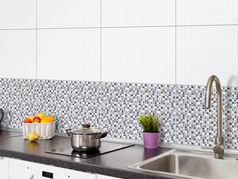 Classic white kitchen design with sink and fruit basket